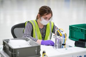 Engineers and technicians set-up and test the machines that will be used to manufacture Level 1 face masks Monday, March 30, 2020 at the General Motors Warren, Michigan manufacturing facility. Production will begin next week and within two weeks ramp up to 50,000 masks per day, with the potential to increase to 100,000 per day. (Photo by John F. Martin for General Motors)