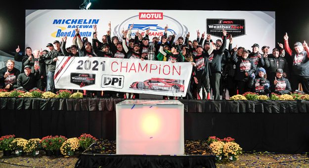 #31: Whelen Engineering Racing Cadillac DPi, DPi: Felipe Nasr, Pipo Derani, Mike Conway celebrate winning the championship on the podium with team and guests