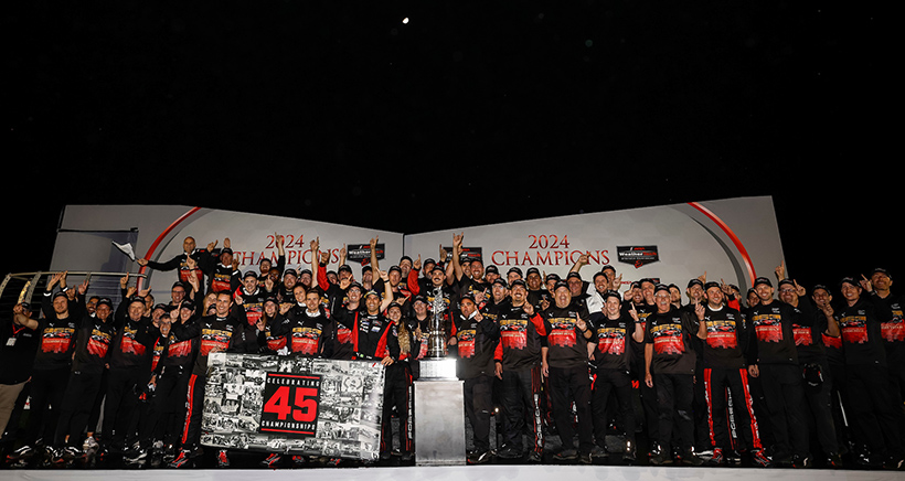 #7: Porsche Penske Motorsports, Porsche 963, GTP: Felipe Nasr, Dane Cameron, Matt Campbell celebrates their championship on the podium