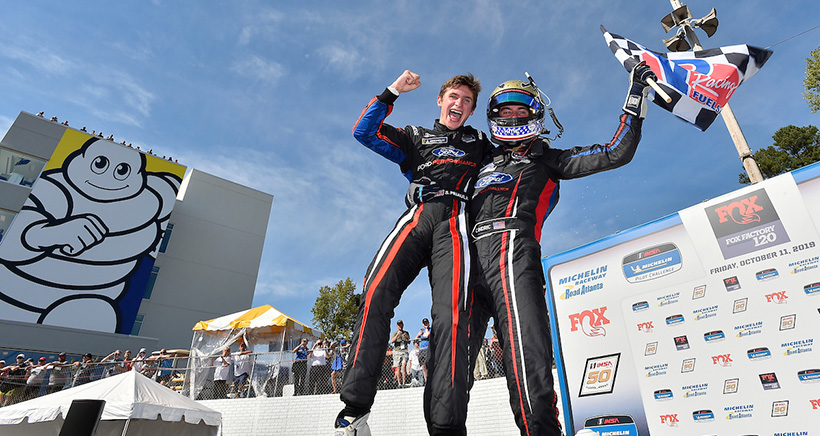 #15 Multimatic Motorsports Ford Mustang GT4, GS: Austin Cindric, Sebastian Priaulx celebrate the win in victory lane