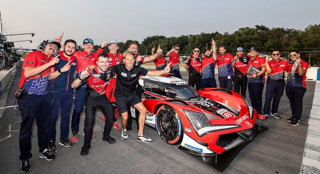 Motul Pole Award winner #93: Acura Meyer Shank Racing w/Curb Agajanian, Acura ARX-06, GTP: Nick Yelloly celebrates with teammate Renger Van der Zende and Acura HRC engineers