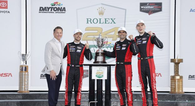 #7: Porsche Penske Motorsport, Porsche 963, GTP: Felipe Nasr, Julien Andlauer, Laurin Heinrich celebrate in victory lane