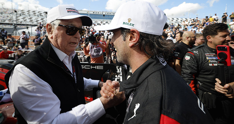 #7: Porsche Penske Motorsport, Porsche 963, GTP: Felipe Nasr, and team owner Roger Penske celebrate in victory lane