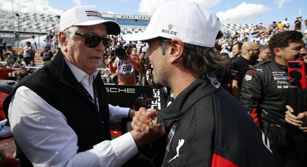 #7: Porsche Penske Motorsport, Porsche 963, GTP: Felipe Nasr, and team owner Roger Penske celebrate in victory lane