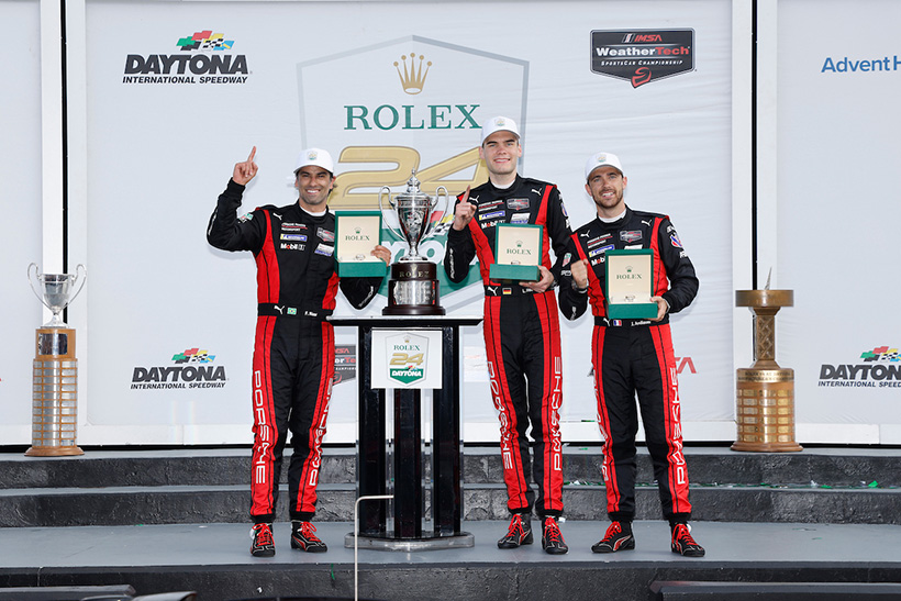 #7: Porsche Penske Motorsport, Porsche 963, GTP: Felipe Nasr, Julien Andlauer, Laurin Heinrich celebrate on the podium