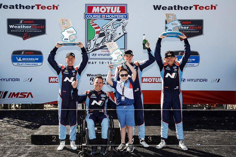 #33: Bryan Herta Autosport with Curb Agajanian, Hyundai Elantra N TCR, TCR: Harry Gottsacker, Robert Wickens, #98: Bryan Herta Autosport with Curb Agajanian, Hyundai Elantra N TCR, TCR: Mark Wilkins, Mason Filippi, podium, Hyundai Hope on Wheels kid Oliver Foster with the trophy given to him by Mark Wilkins