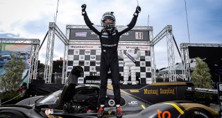 Winner #5: JDC-Miller MotorSports, Porsche 963, GTP: Laurin Heinrich, on the podium
