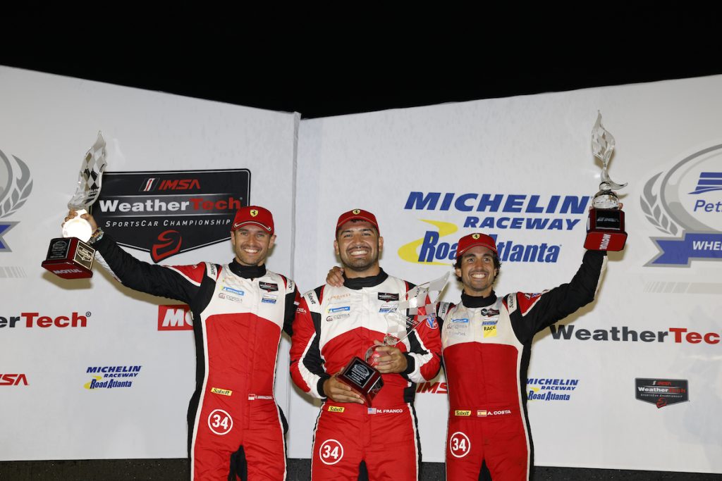 #34: Conquest Racing, Ferrari 296 GT3, GTD: Manny Franco, Albert Costa Balboa, Cedric Sbirrazzuoli celebrates on the podium