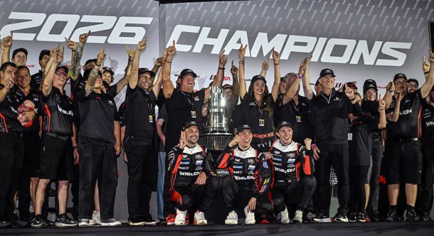#31: Cadillac Whelen, Cadillac V-Series.R, GTP: Jack Aitken, Earl Bamber, Frederik Vesti celebrate their championship in victory lane
