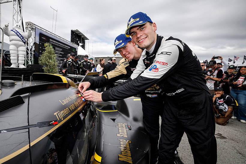 #5: JDC-Miller MotorSports, Porsche 963, GTP: Tijmen van der Helm, Laurin Heinrich in victory lane with the winners’ sticker